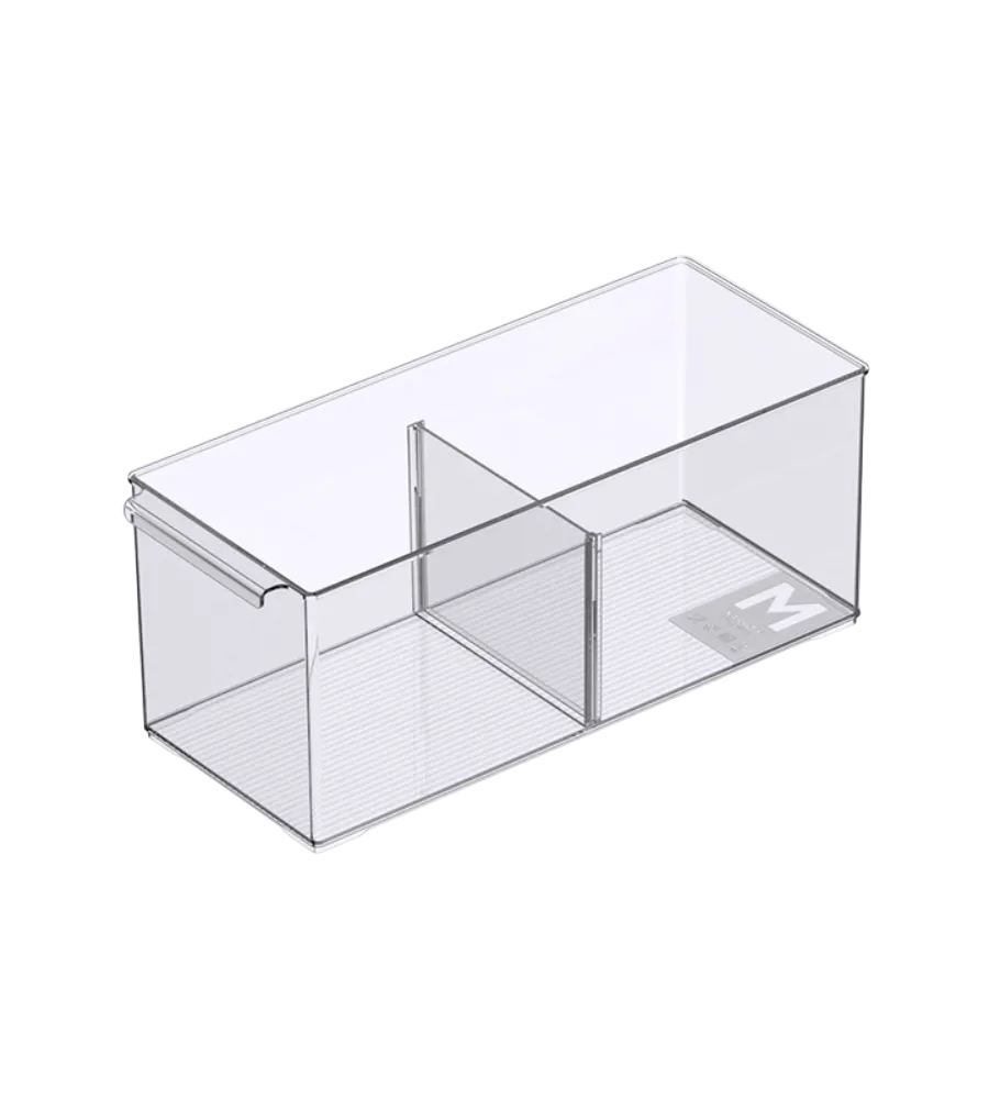 The BNB x VCN KLAR storage container with compartments – various sizes, extra long – features a clear rectangular design, smooth surface, small M label, center bar, and removable compartments for flexible organization.